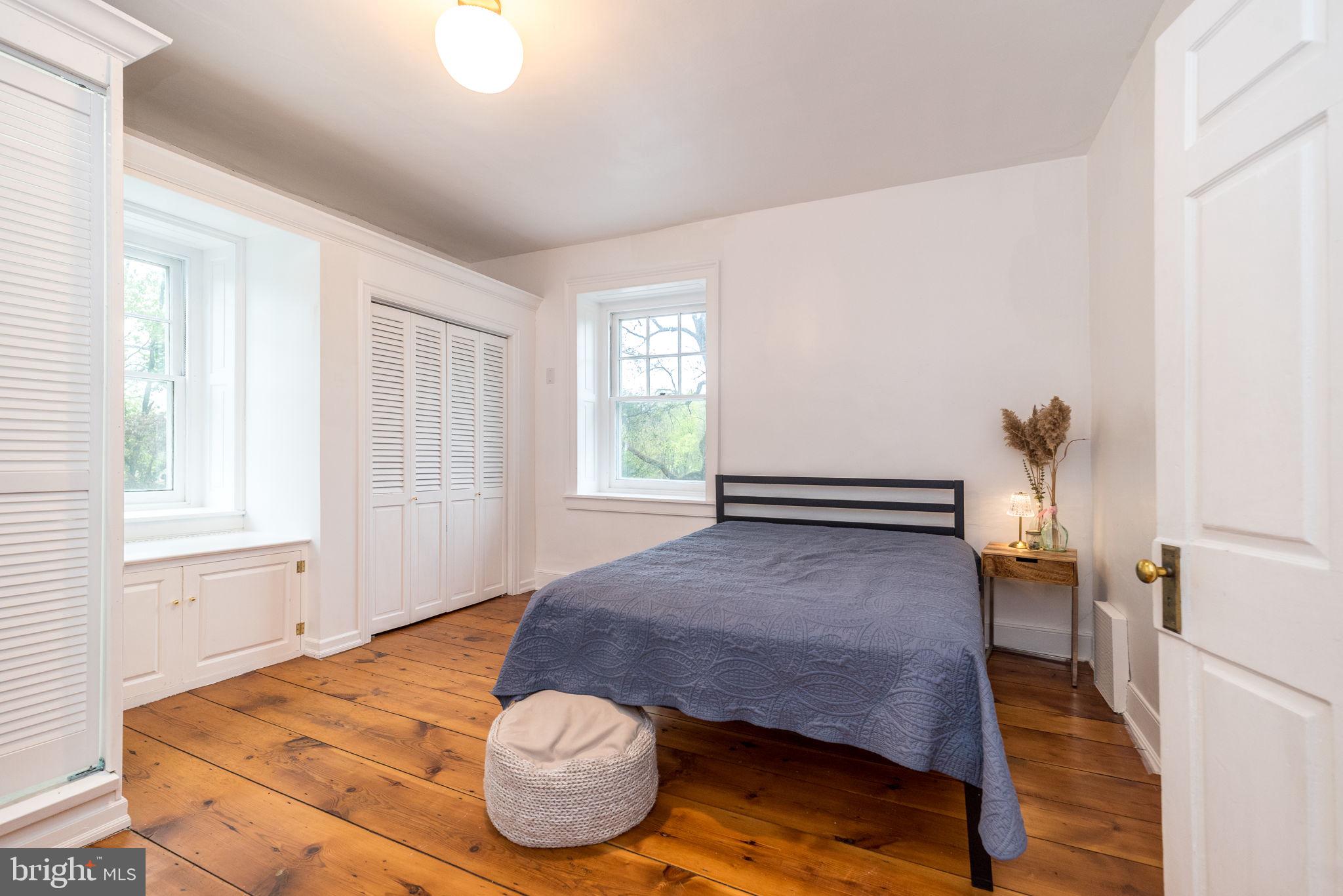 866 Schuylkill Road Birdsboro, PA 19508 - Photo 49 of 73 a bedroom with a bed and wooden floor