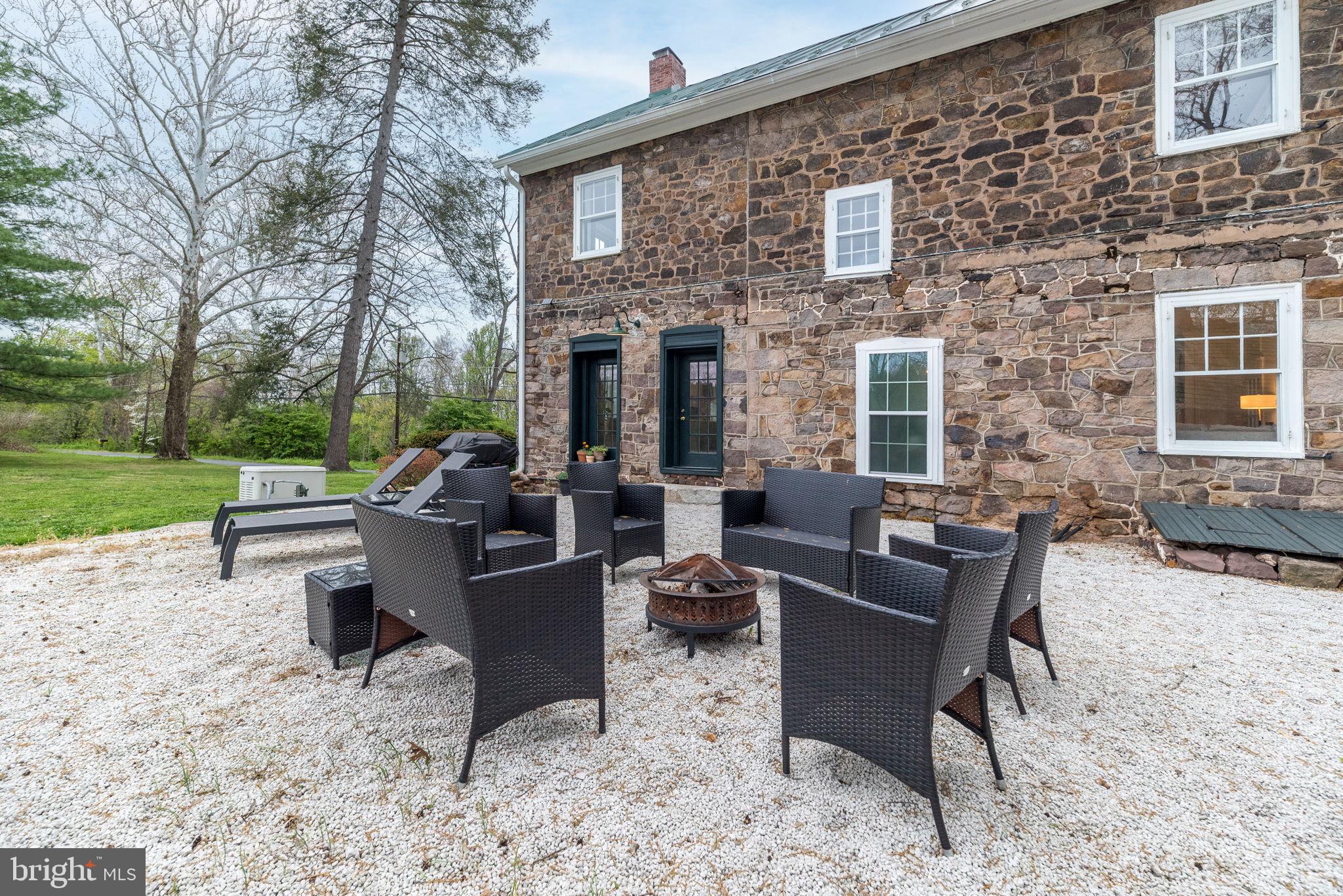 866 Schuylkill Road Birdsboro, PA 19508 - Photo 55 of 73 a view of a patio with couches chairs and a yard