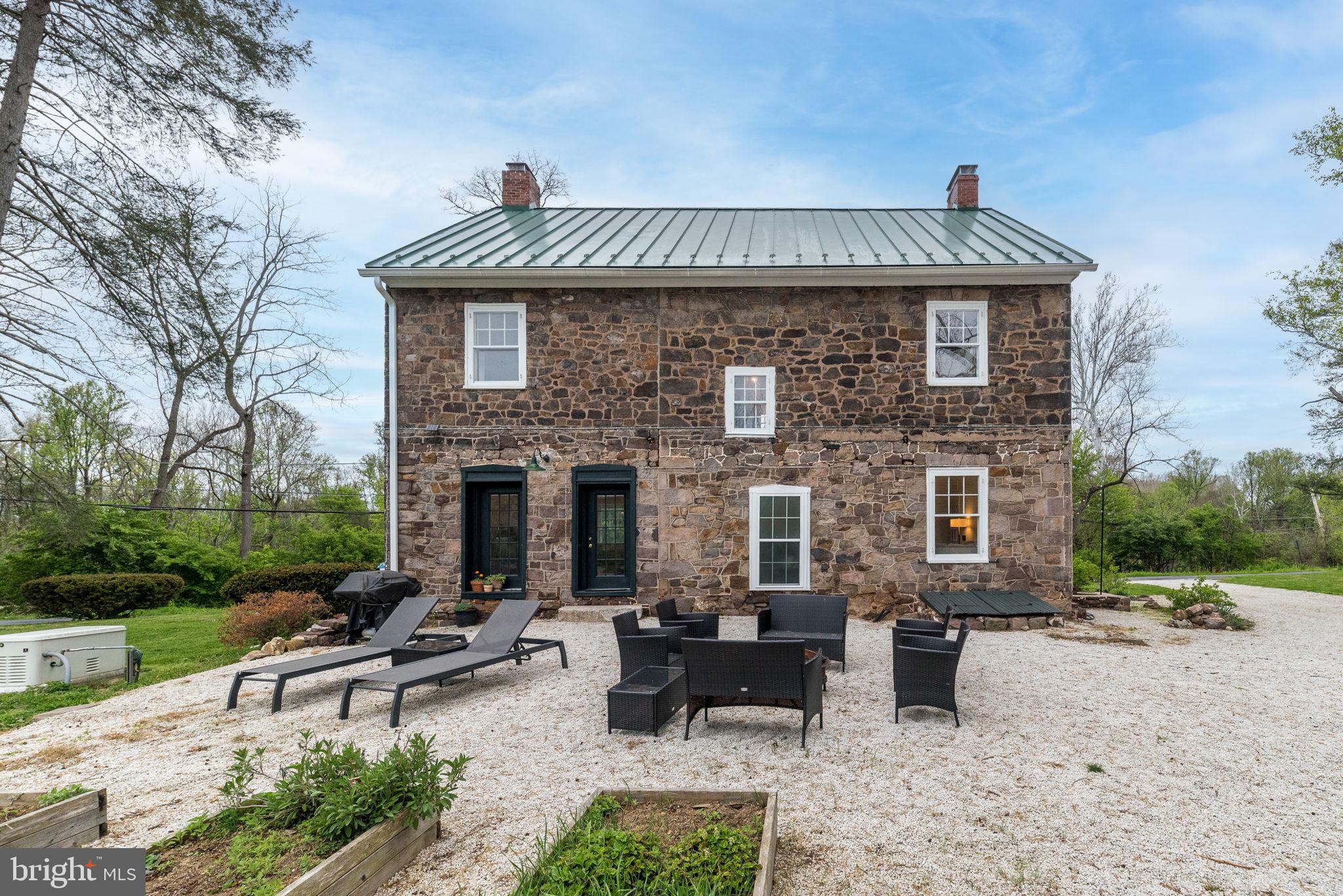 866 Schuylkill Road Birdsboro, PA 19508 - Photo 61 of 73 a view of a patio with table and chairs a barbeque