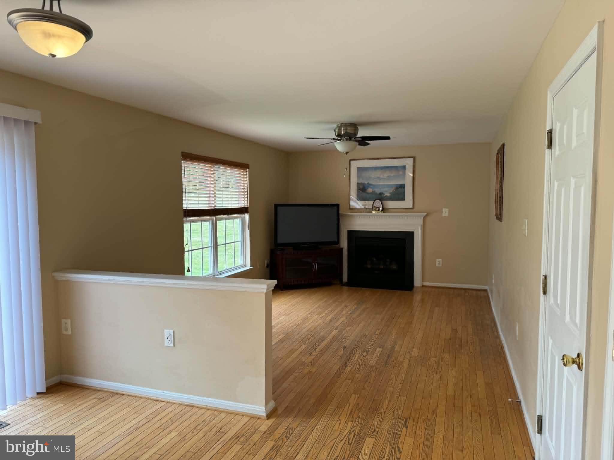 3826 Roundtree Road Jefferson, MD 21755 - Photo 11 of 19 an empty room with wooden floor and windows
