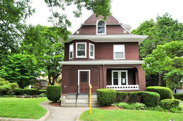 19 Marion Road Watertown, MA 02472 - Photo 15 of 20 a front view of a house with a yard and garage