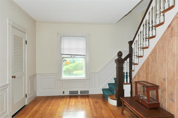 19 Marion Road Watertown, MA 02472 - Photo 4 of 20 a view of entryway with wooden floor and stairs