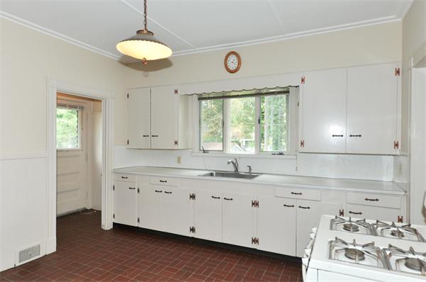 19 Marion Road Watertown, MA 02472 - Photo 5 of 20 a kitchen with granite countertop white cabinets and window
