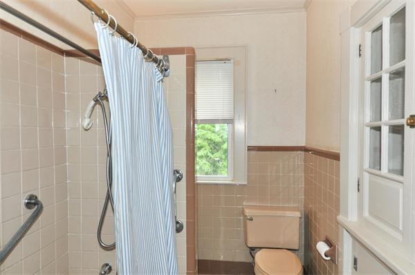 19 Marion Road Watertown, MA 02472 - Photo 8 of 20 a bathroom with a shower and toilet