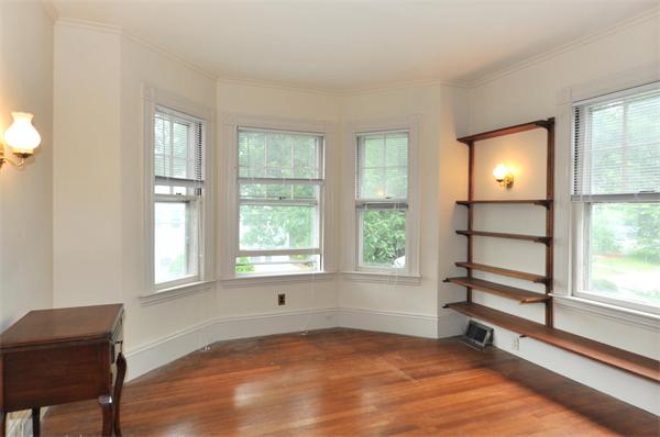 19 Marion Road Watertown, MA 02472 - Photo 10 of 20 a view of an empty room with a window and wooden floor