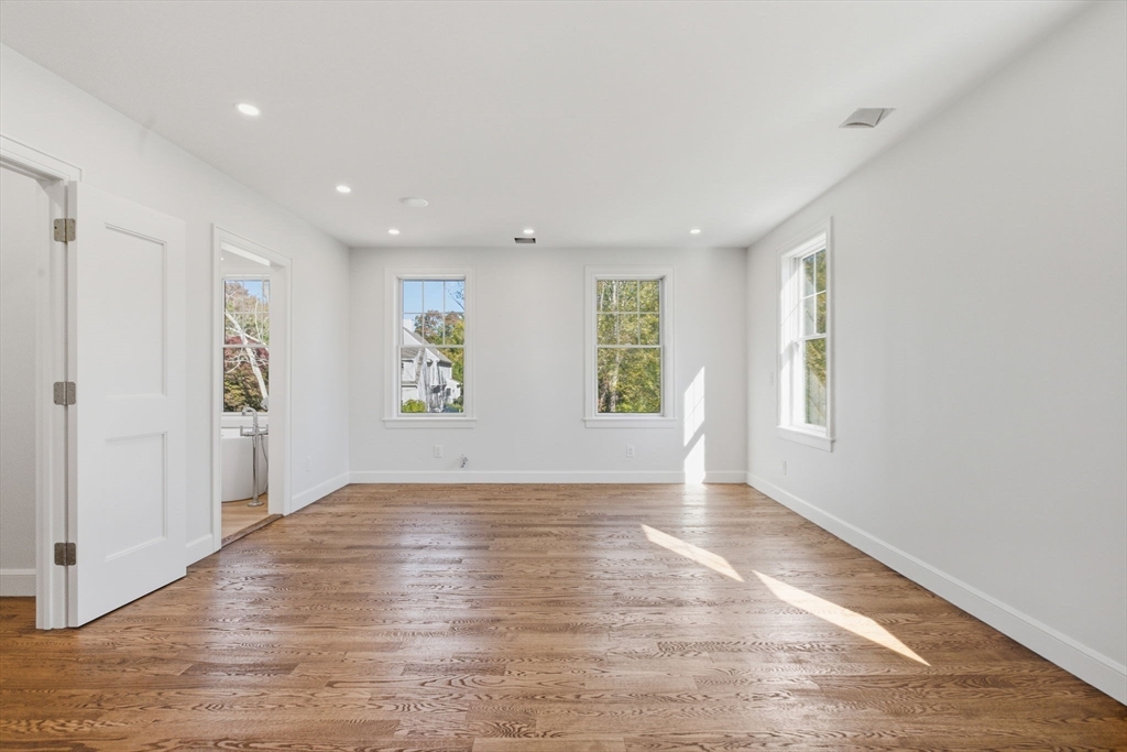 131 Maple Street Scituate, MA 02066 - Photo 12 of 38 wooden floor in an empty room with a window