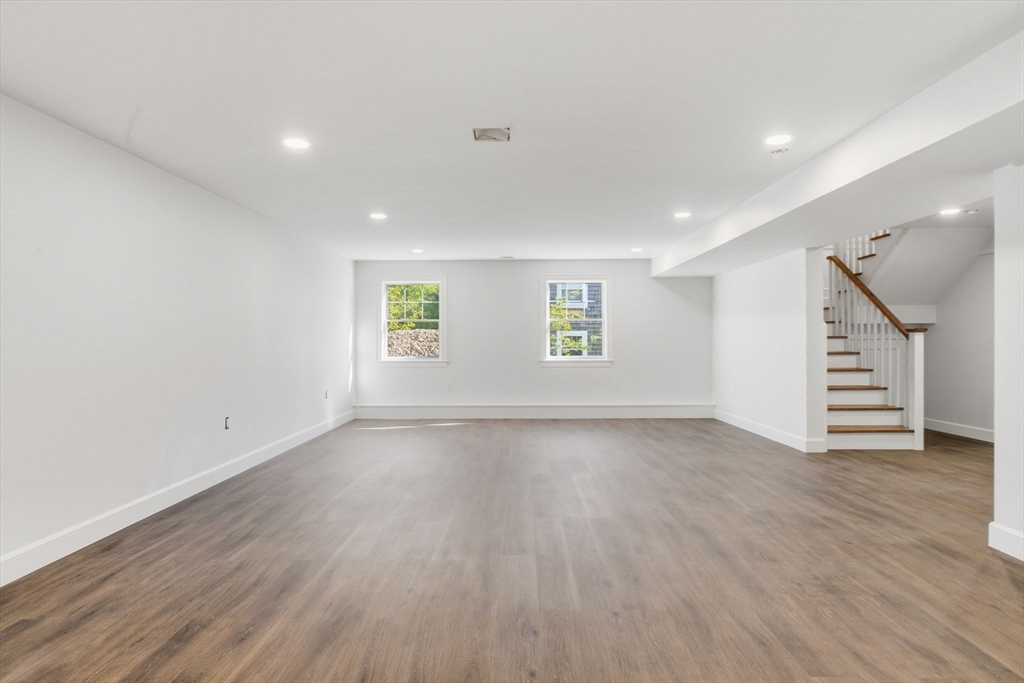 131 Maple Street Scituate, MA 02066 - Photo 17 of 38 an empty room with wooden floors and window
