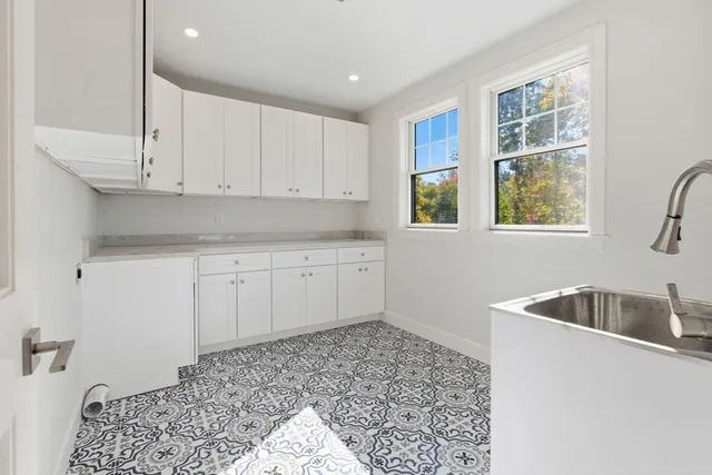 a kitchen that has a sink and a stove