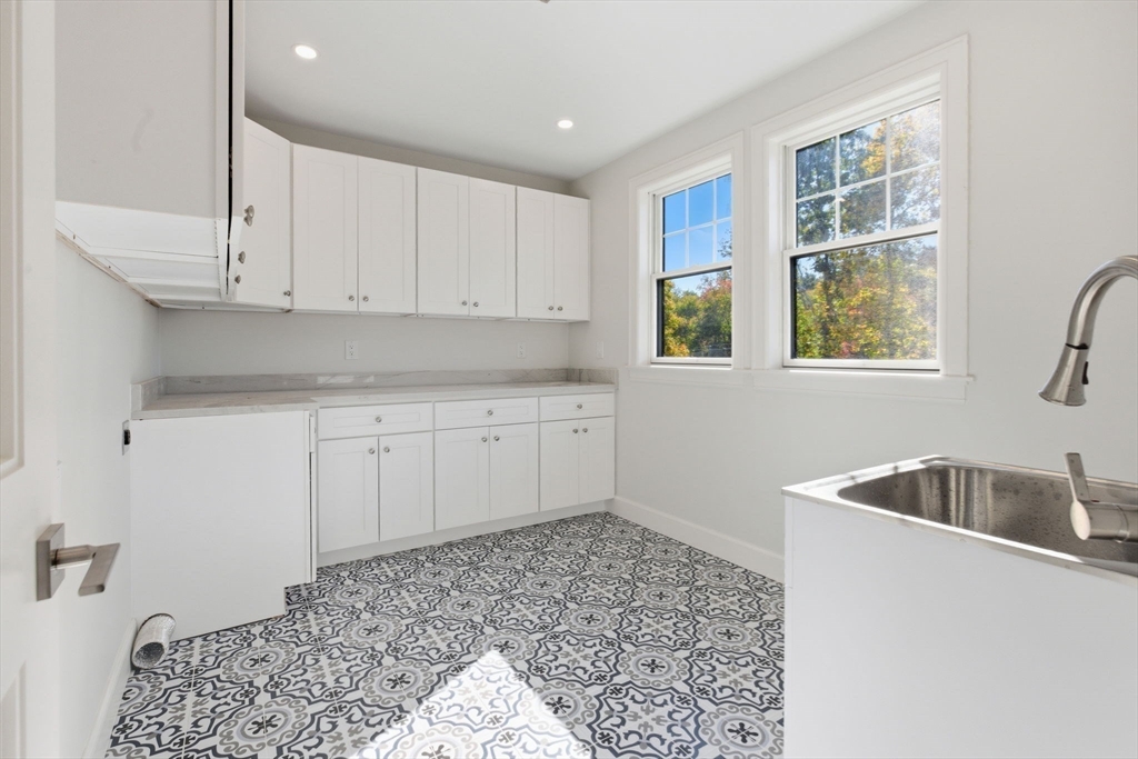 131 Maple Street Scituate, MA 02066 - Photo 18 of 38 a kitchen that has a sink and a stove