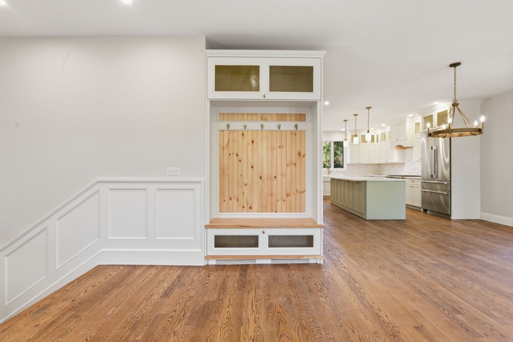 131 Maple Street Scituate, MA 02066 - Photo 19 of 38 a view of a room with wooden floor and windows