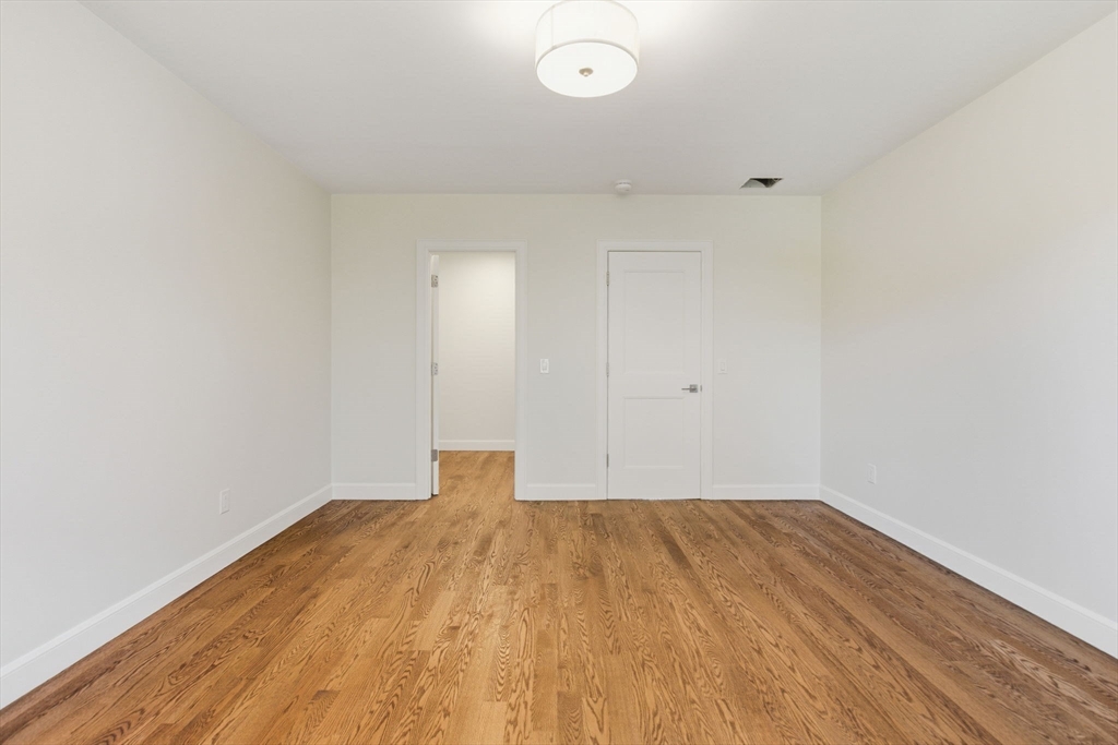 131 Maple Street Scituate, MA 02066 - Photo 22 of 38 a view of empty room with wooden floor