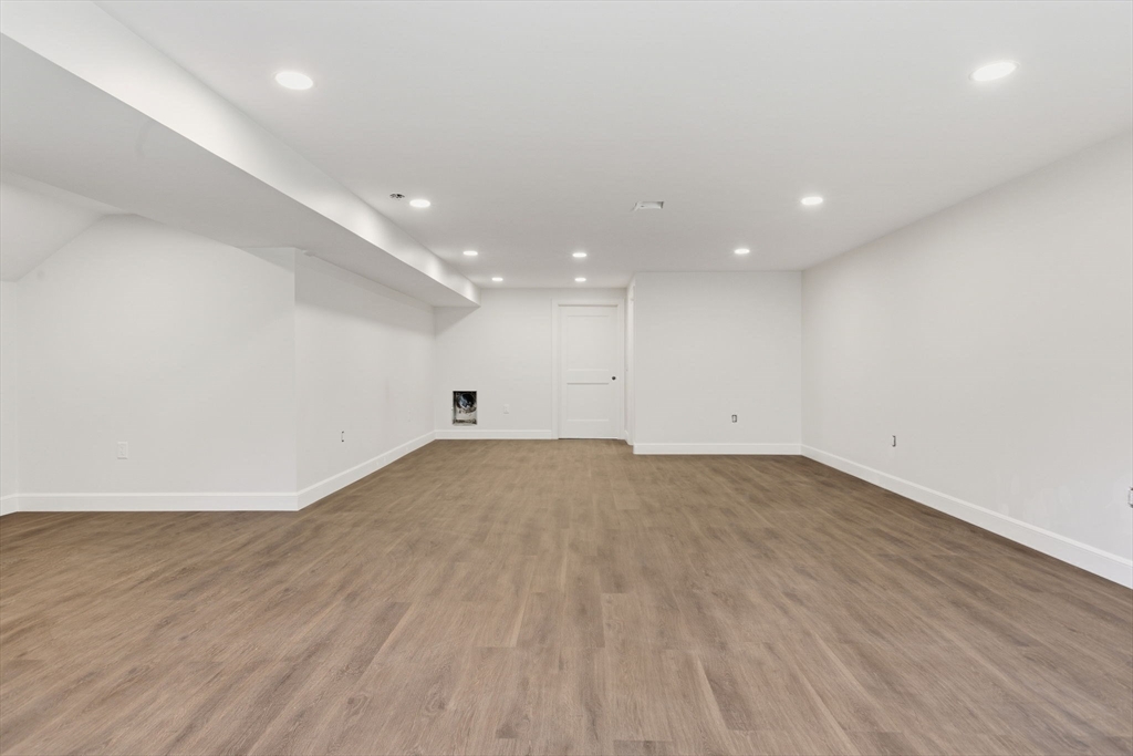 131 Maple Street Scituate, MA 02066 - Photo 33 of 38 an empty room with wooden floor and natural light