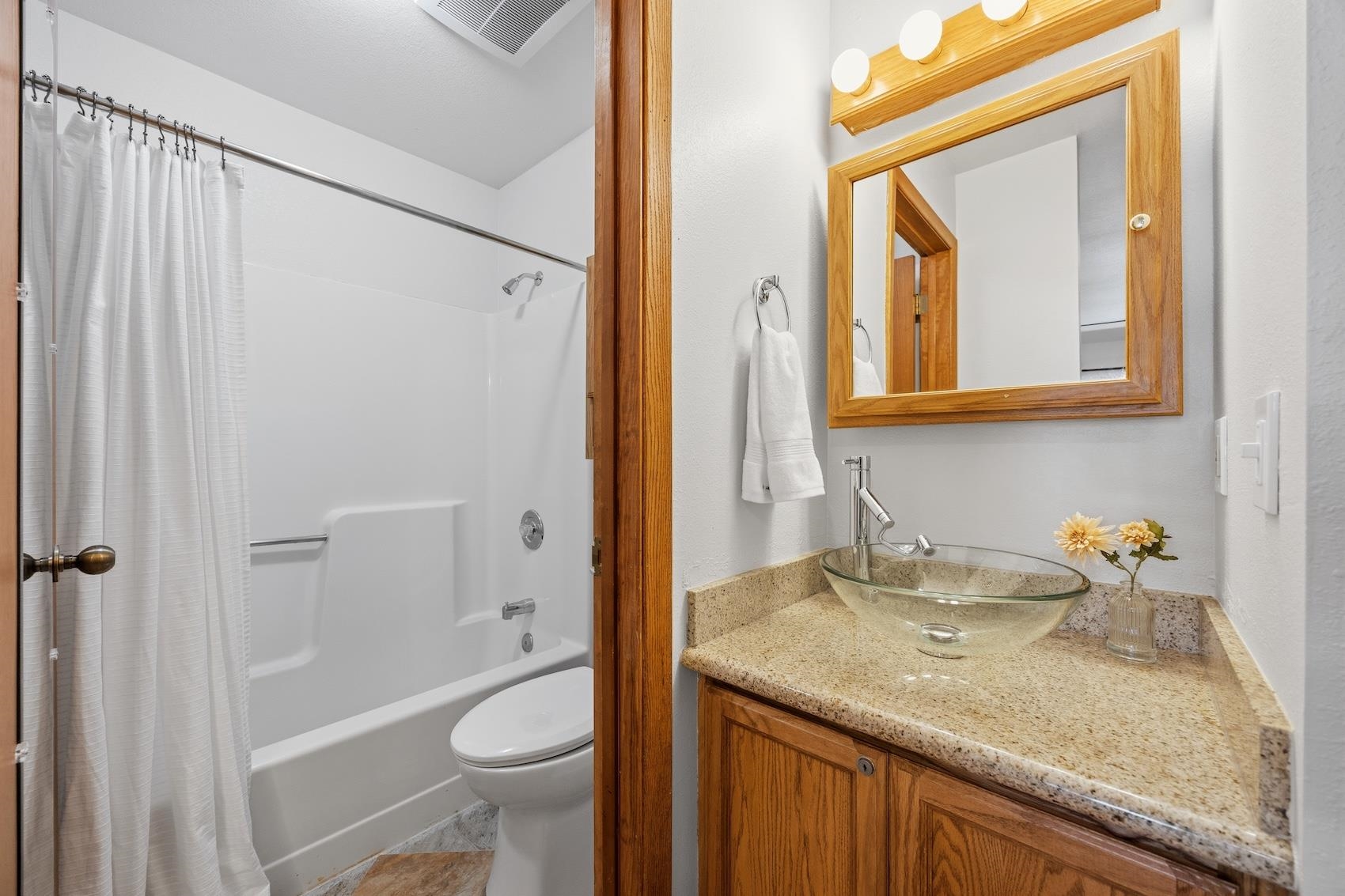 10150 Ski Ranch Lane, Unit 309 Soda Springs, CA 95728 - Photo 14 of 19 a bathroom with a granite countertop sink toilet and shower