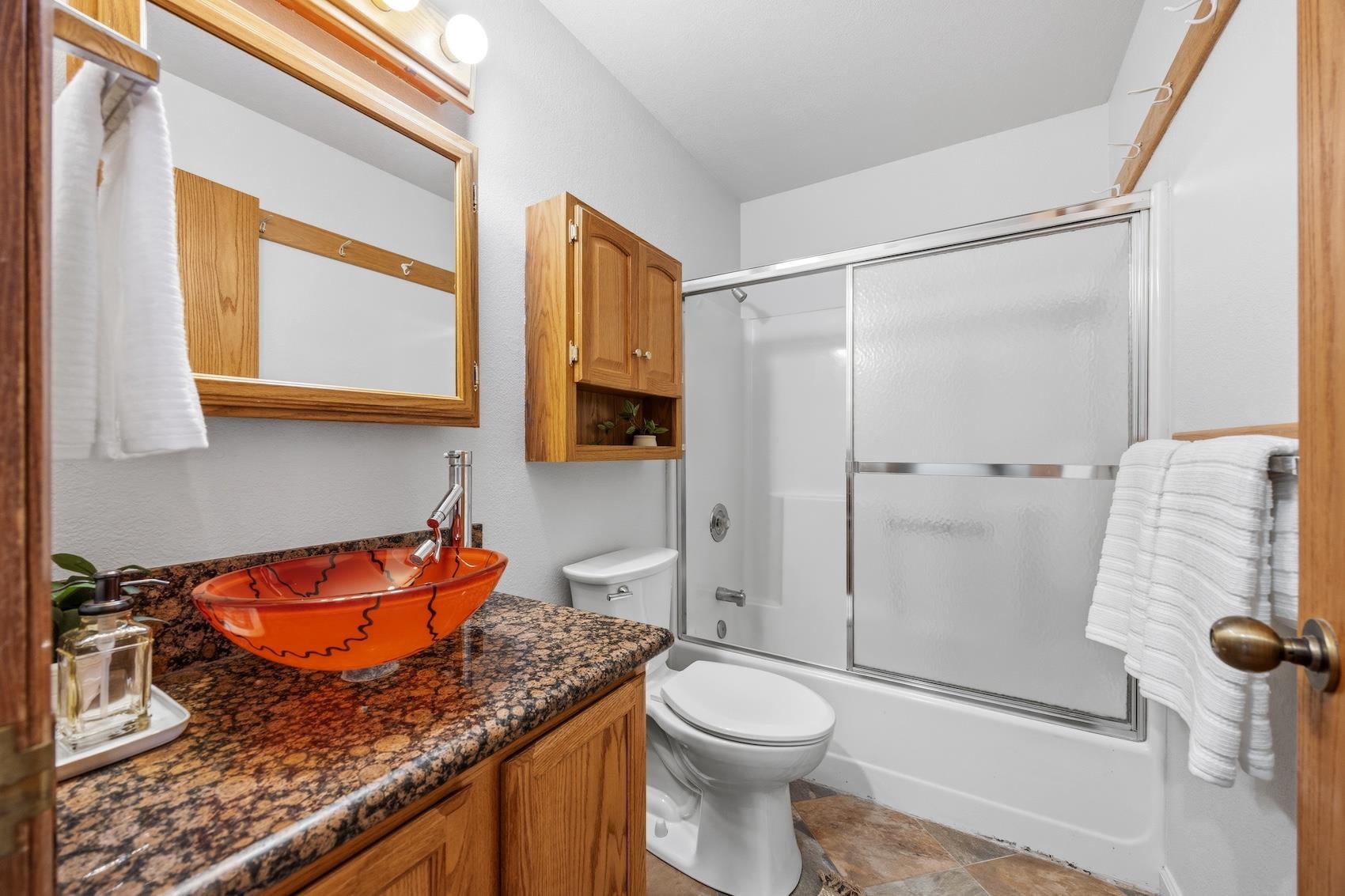 10150 Ski Ranch Lane, Unit 309 Soda Springs, CA 95728 - Photo 15 of 19 a bathroom with a granite countertop sink toilet and shower