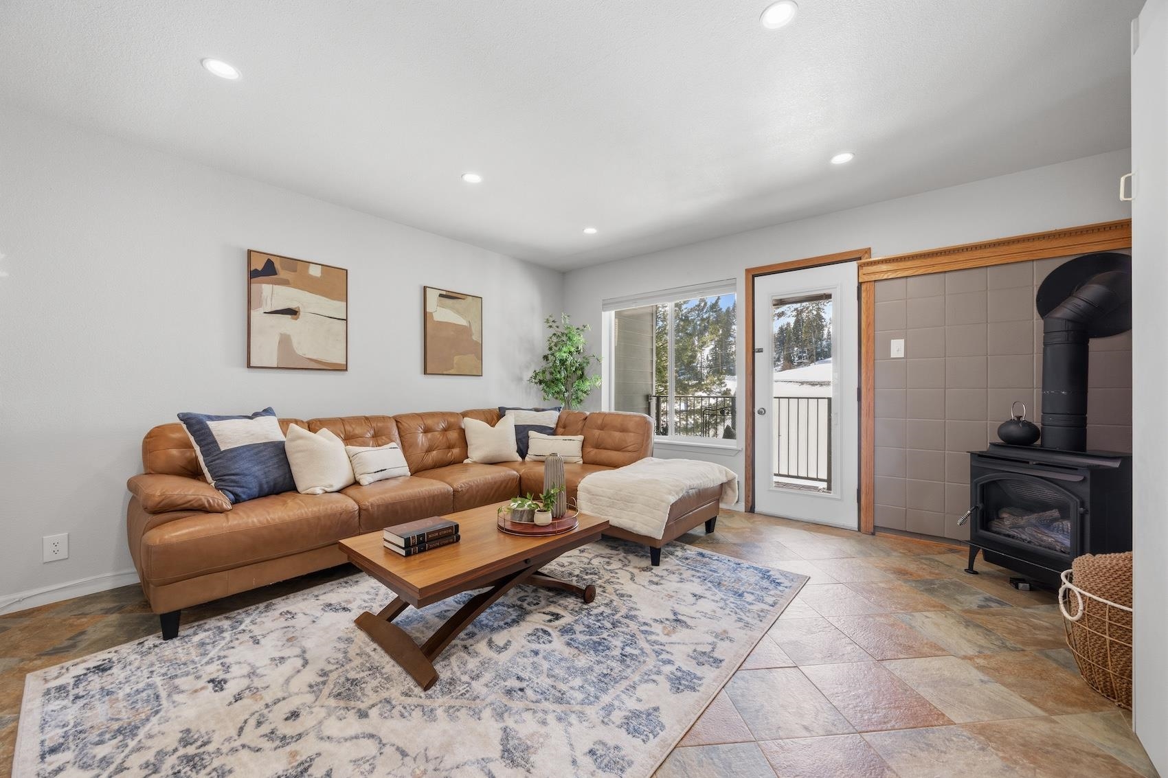 10150 Ski Ranch Lane, Unit 309 Soda Springs, CA 95728 - Photo 2 of 19 a living room with furniture and a flat screen tv
