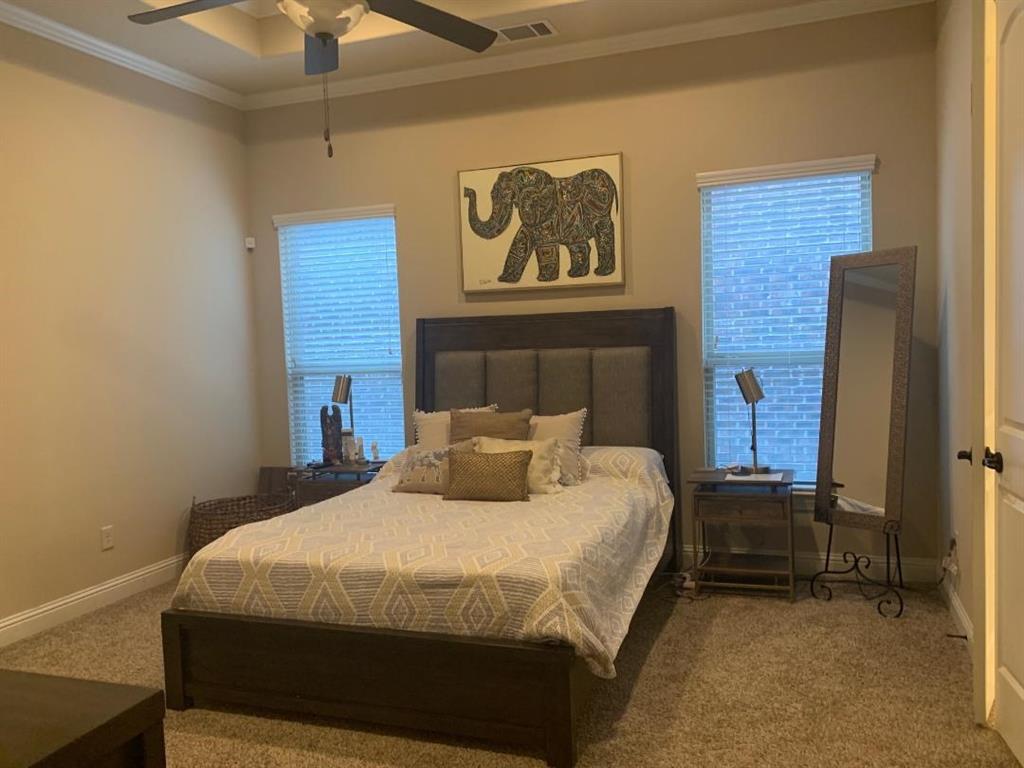 686 Pendle Forest Drive Frisco, TX 75036 - Photo 12 of 22 a bedroom with a bed and a ceiling fan