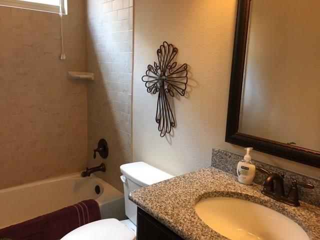 686 Pendle Forest Drive Frisco, TX 75036 - Photo 13 of 22 a bathroom with a granite countertop sink and a mirror