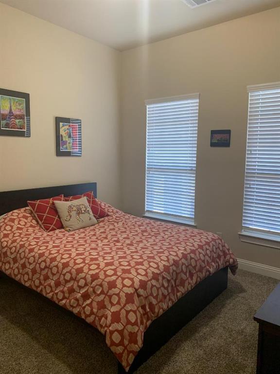 686 Pendle Forest Drive Frisco, TX 75036 - Photo 17 of 22 a bedroom with a bed and window