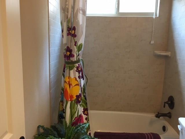 686 Pendle Forest Drive Frisco, TX 75036 - Photo 18 of 22 a bathroom with a shower and a curtain