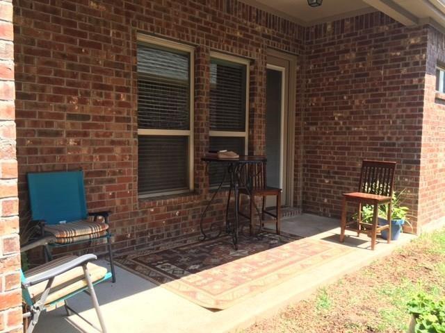 686 Pendle Forest Drive Frisco, TX 75036 - Photo 21 of 22 a backyard of a house with table and chairs
