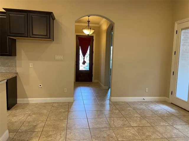 a view of a livingroom with wooden floor and cabinet