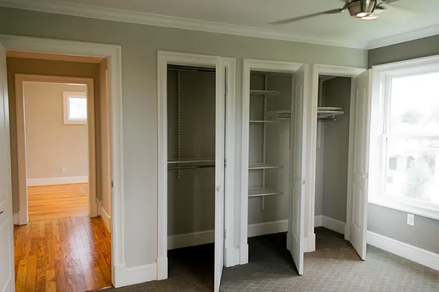 a view of walk in closet with empty racks