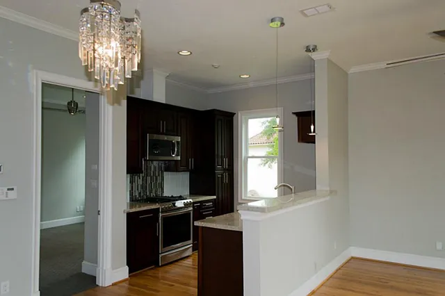 a view of a kitchen from the hallway