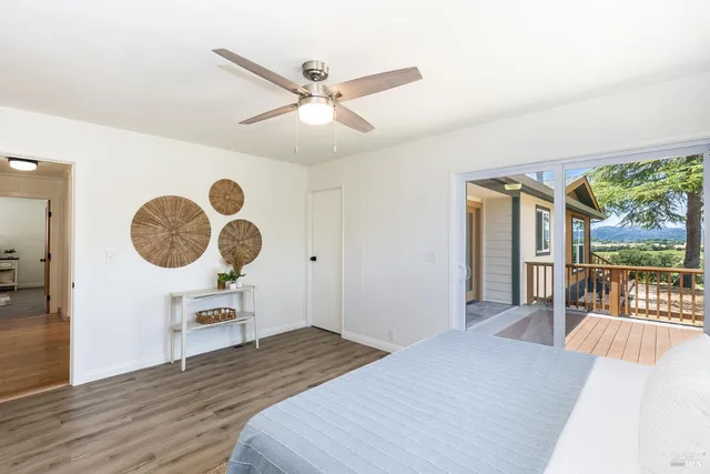 a spacious bathroom with a toilet sink and mirror