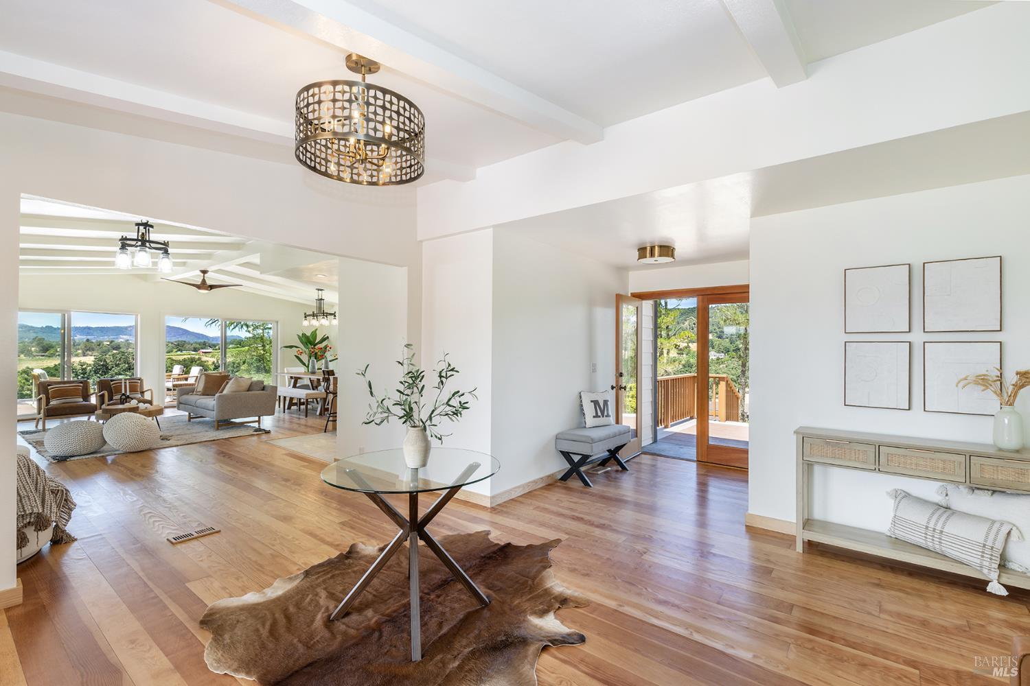 1676 Chiquita Road Healdsburg, CA 95448 - Photo 5 of 45 a view of a livingroom with furniture wooden floor and a large window