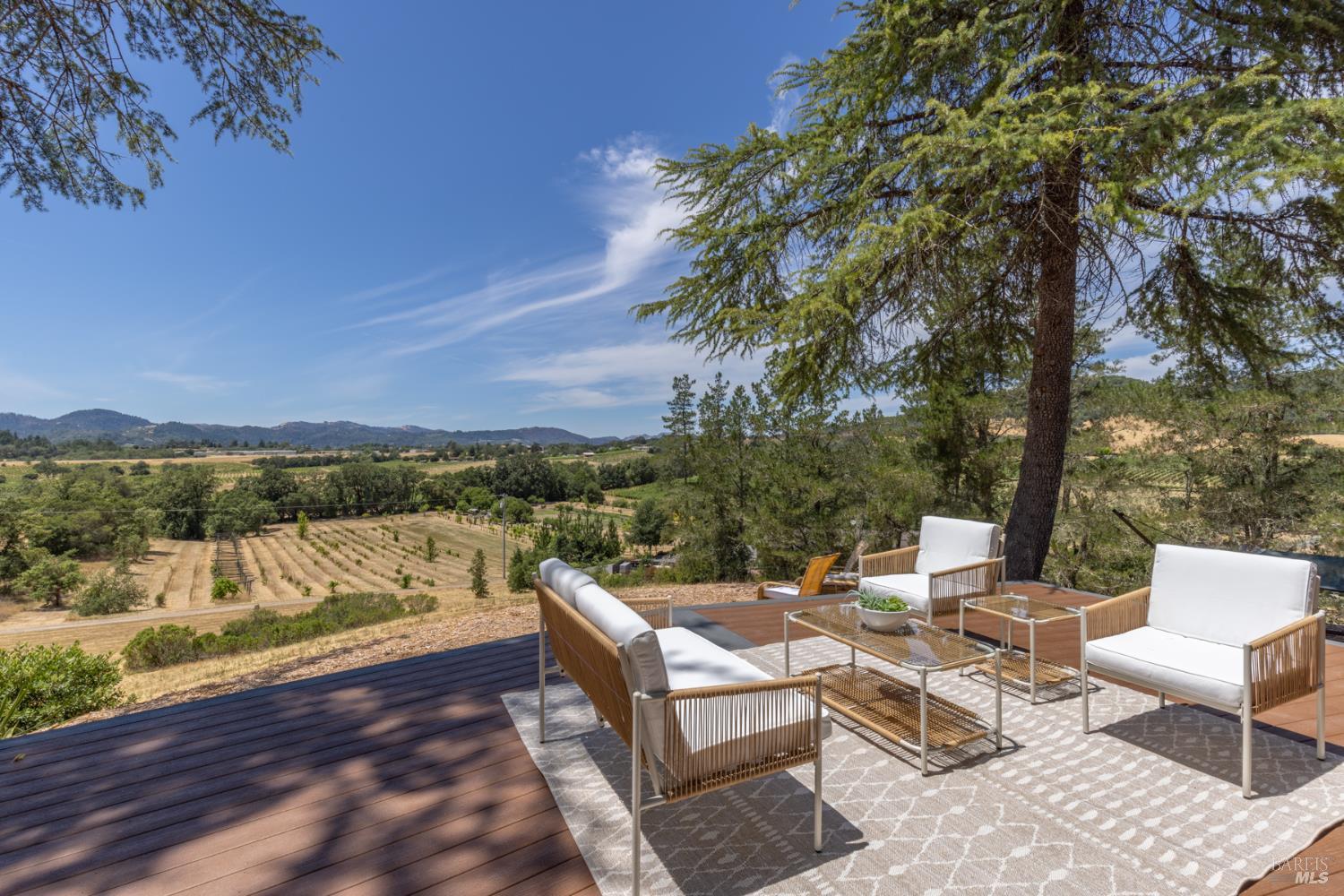 1676 Chiquita Road Healdsburg, CA 95448 - Photo 9 of 45 a view of a patio with a table under an umbrella