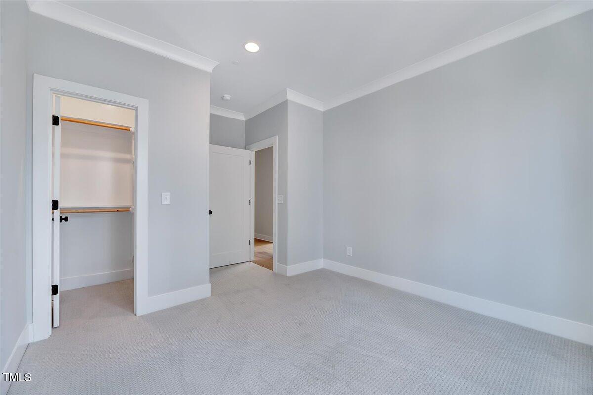 811 Maple Berry Lane, Unit 106 Raleigh, NC 27607 - Photo 18 of 30 a view of an empty room