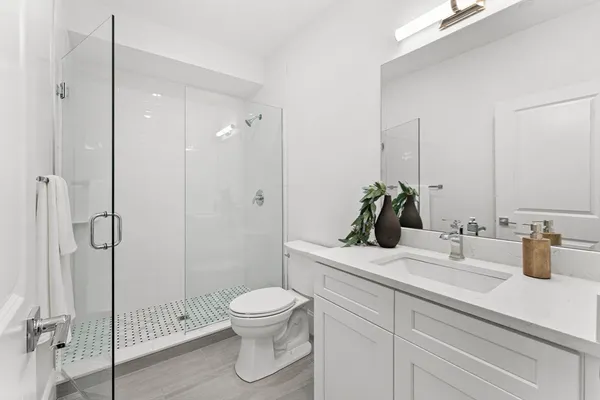 a bedroom with a bed and a couch