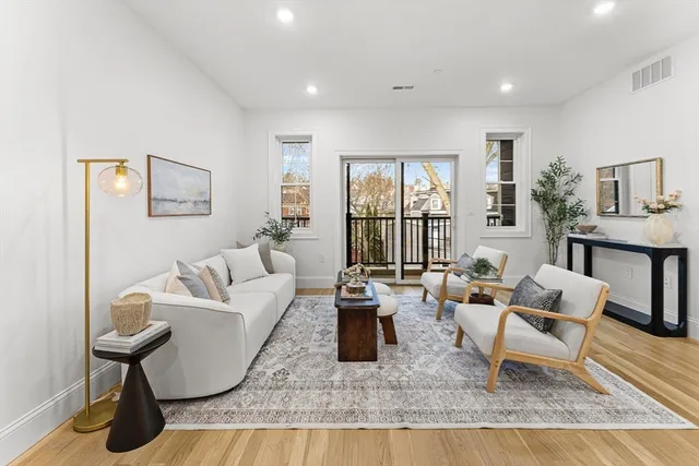 a bed room with a bed mirror and a table