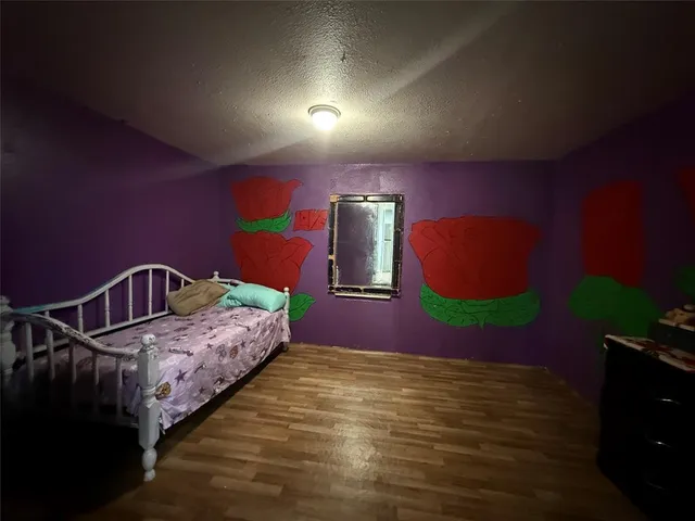 a bedroom with bed and window