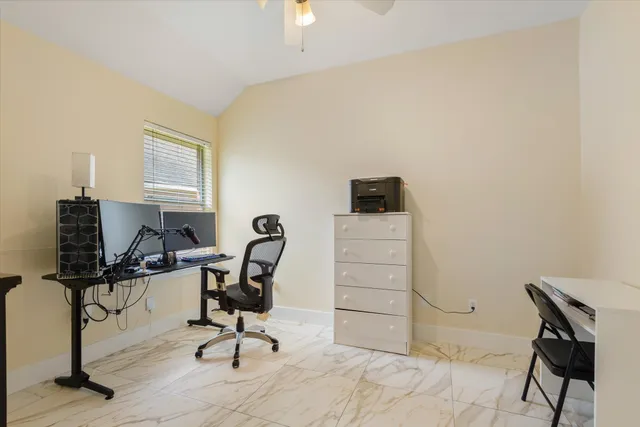 a view of a workspace with furniture