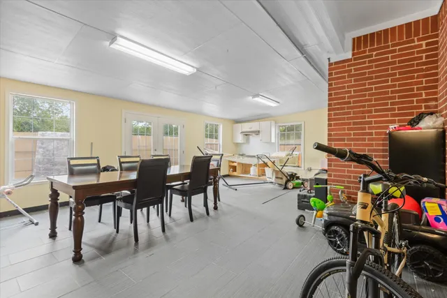 a view of a dining room with furniture window and outside view