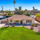 a aerial view of a house with a garden and outdoor seating