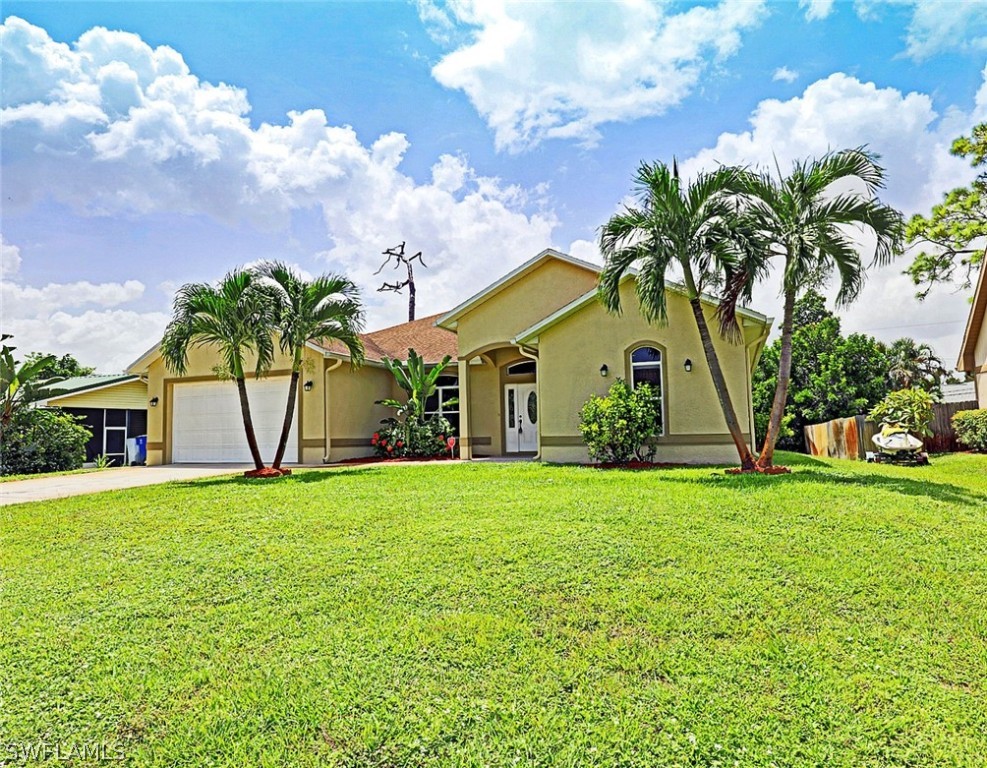a front view of a house with garden