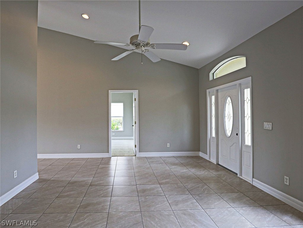 18242 Hemlock Road Fort Myers, FL 33967 - Photo 11 of 29 a view of an empty room with window and chandelier fan