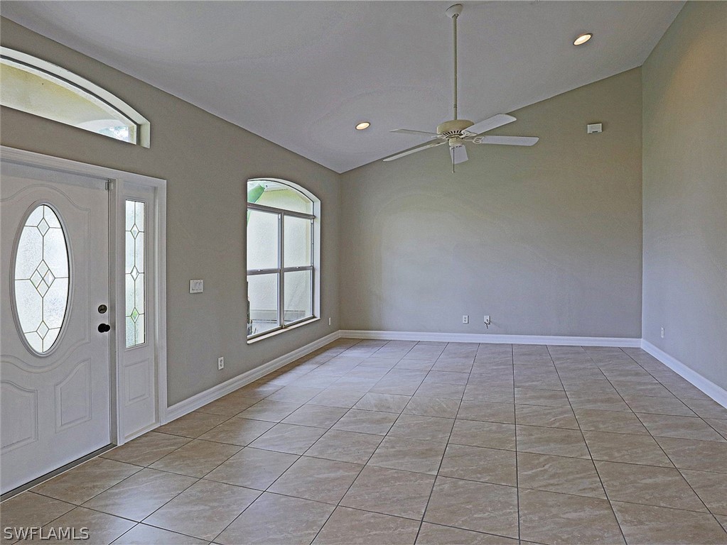 18242 Hemlock Road Fort Myers, FL 33967 - Photo 12 of 29 an empty room with windows and fan