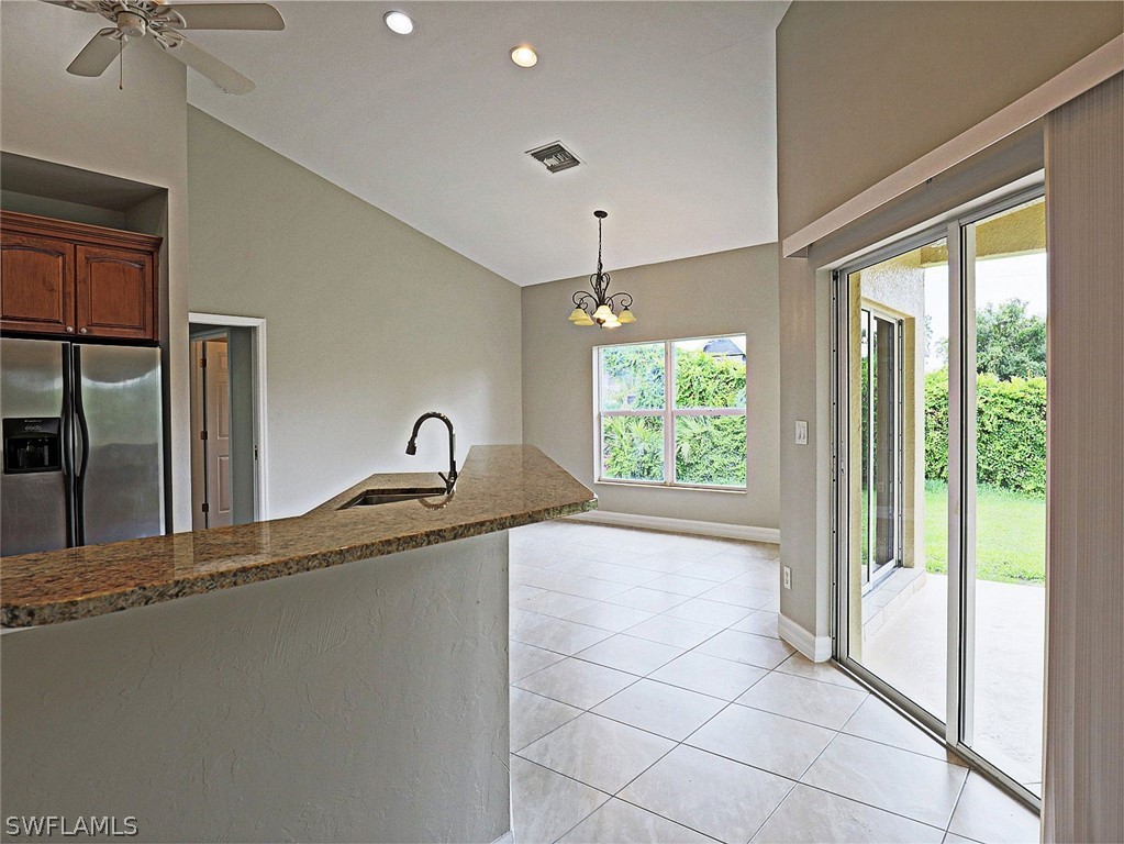 18242 Hemlock Road Fort Myers, FL 33967 - Photo 20 of 29 a view of a kitchen with a sink and windows