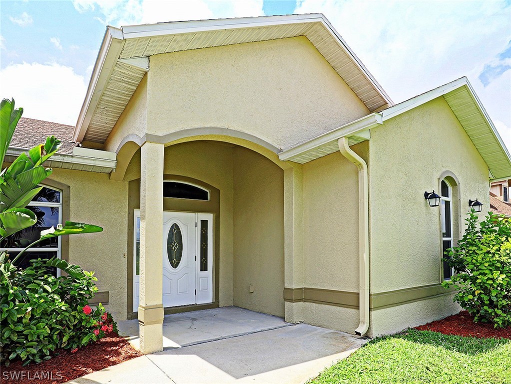 18242 Hemlock Road Fort Myers, FL 33967 - Photo 2 of 29 a front view of a house with shower