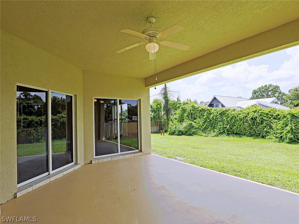 18242 Hemlock Road Fort Myers, FL 33967 - Photo 5 of 29 a view of a big room with a big yard and potted plants
