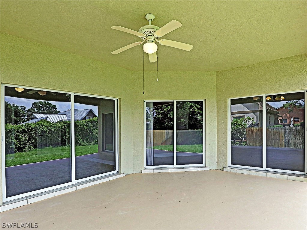 18242 Hemlock Road Fort Myers, FL 33967 - Photo 6 of 29 a view of the house with a floor to ceiling window and ceiling fan