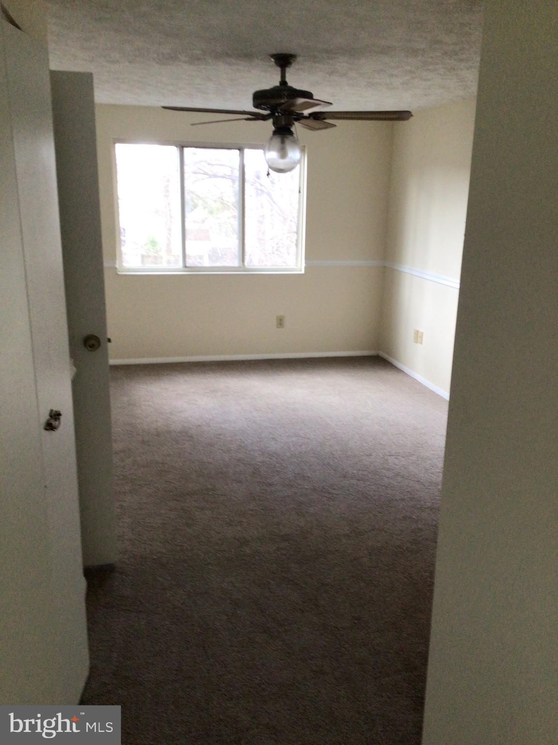 7679 Tuckerman Drive Hanover, MD 21076 - Photo 21 of 30 an empty room with a window