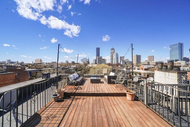 a view of a balcony with chairs