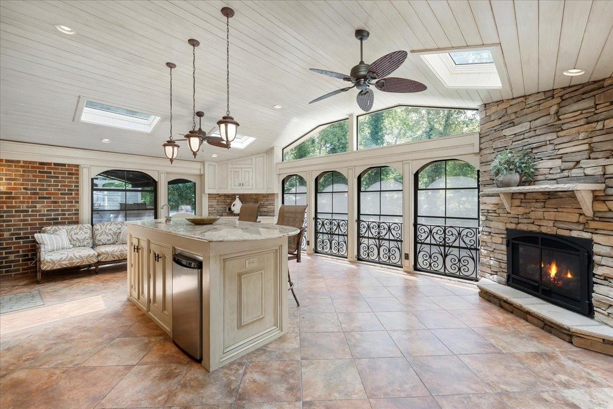 1213 Marlowe Road Raleigh, NC 27609 - Photo 16 of 30 Large 3 Season Entertaining Porch with Gas Fireplace, Wet Bar, Tile Floor, Storage Entertaining Porch