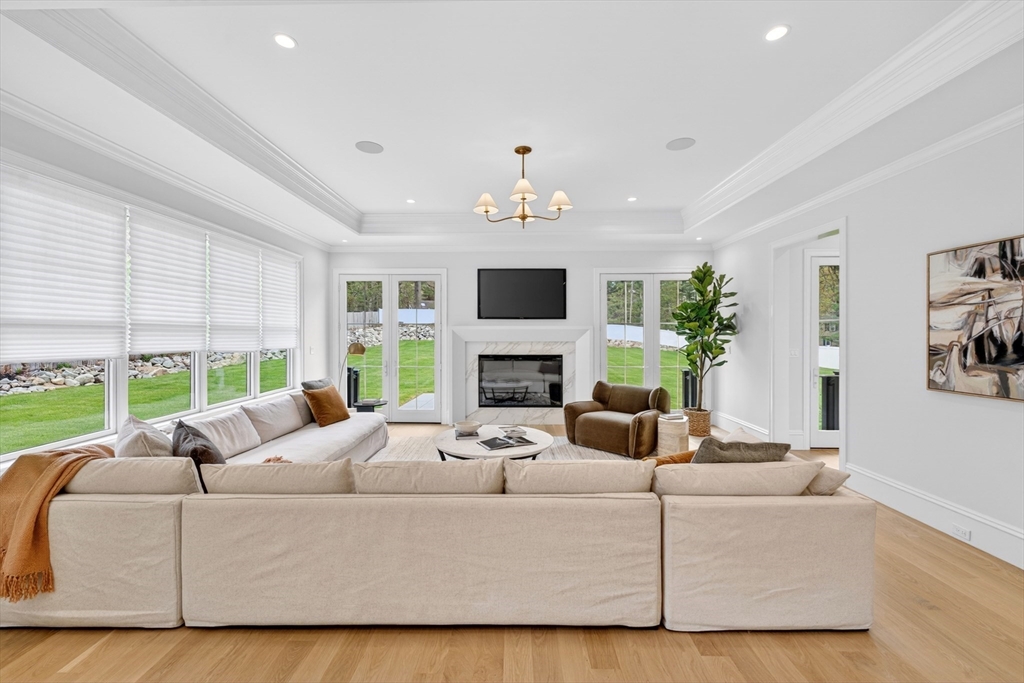 8 Crestview Road Needham, MA 02492 - Photo 9 of 30 a living room with furniture fireplace and large windows