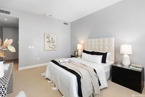 a bedroom with a bed and couch