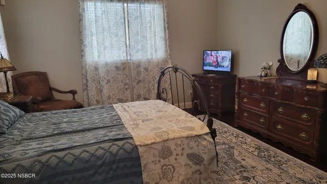 a kitchen with granite countertop a sink stainless steel appliances and cabinets